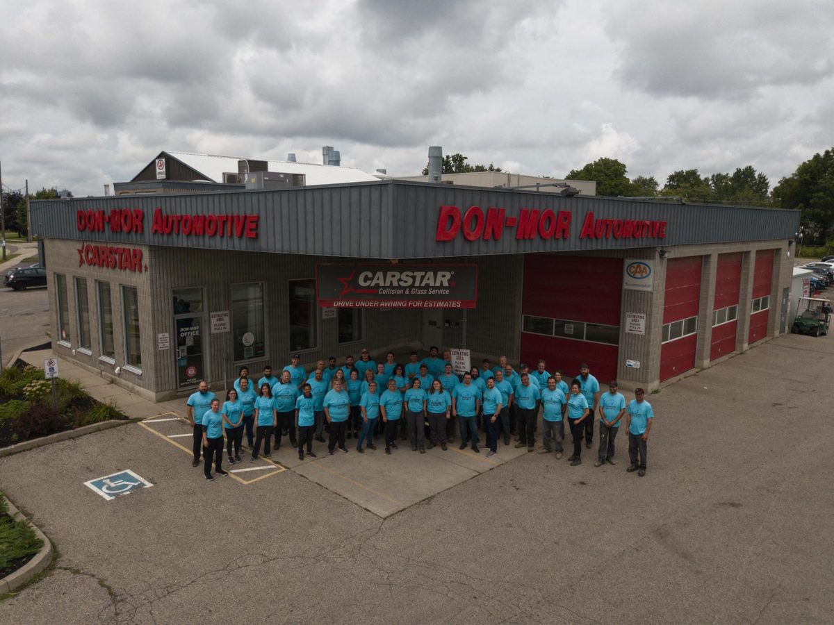 The Don-Mor Automotive Group and CARSTAR team outside the shop